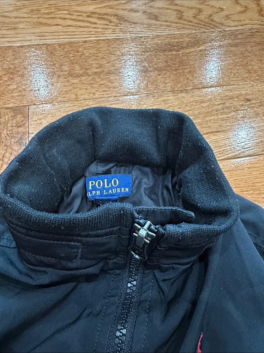 Ralph Lauren Black Jacket with Red Polo Logo, optional hoodie.
